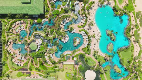 Travel to Luxury Resort Hotel on Island People Relaxing at Blue Swimming Pools