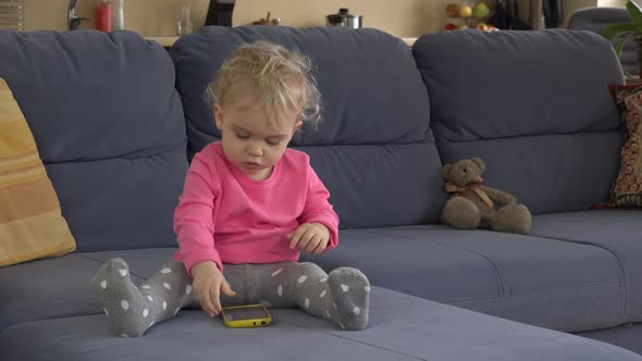 Girl Use Smart Mobile Phone Sit on Sofa Room