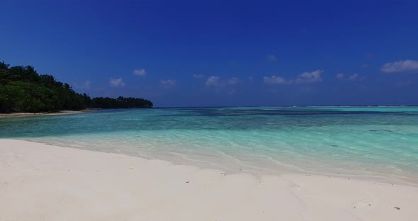 Tropical above abstract shot of a summer white paradise sand beach and aqua turquoise water backgrou