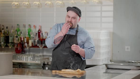 Bearded Tattooed Pizza Chef Tasting Cooked Pinza in Slow Motion