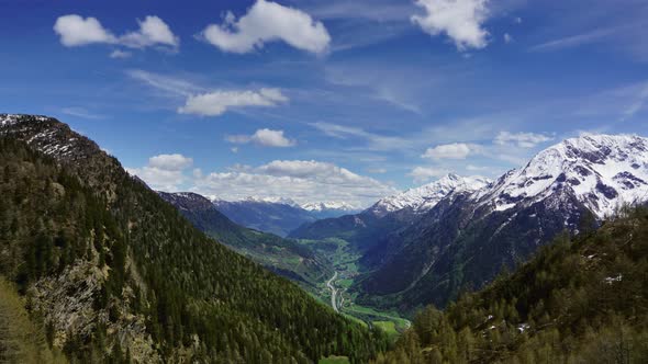 High Mountains and Valley with Road in Switzerland