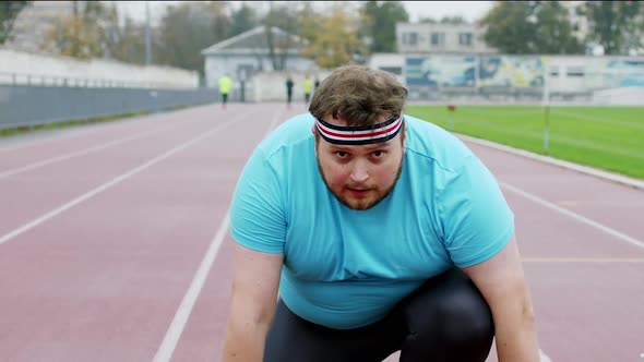 At the Stadium Obese Man Very Charismatic and