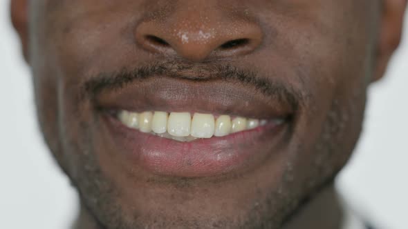 Close Up of Smiling Lips of Young African Man