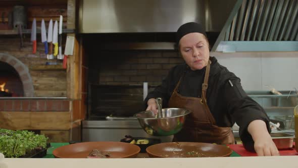 Caucasian woman cooking in the kitchen