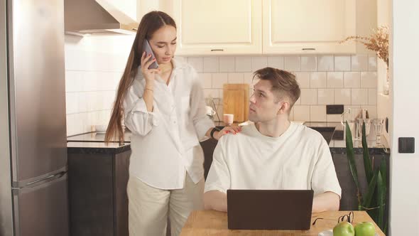 Beautiful Couple at Home, Support and Care From a Loved One During Work at Home.