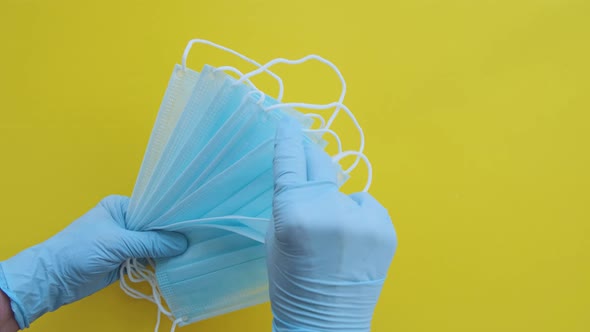 Doctor Showing Respiratory Face Mask Holding Equipment in His Hands Protected Medical Gloves