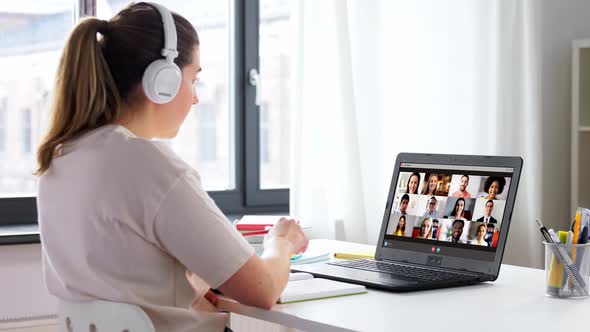 Student Woman with Laptop Having Video Conference
