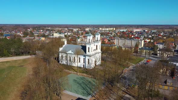 Aerial Shot of Birzai St. John the Baptist Church on the Southern Coast of the Lake Širvėna