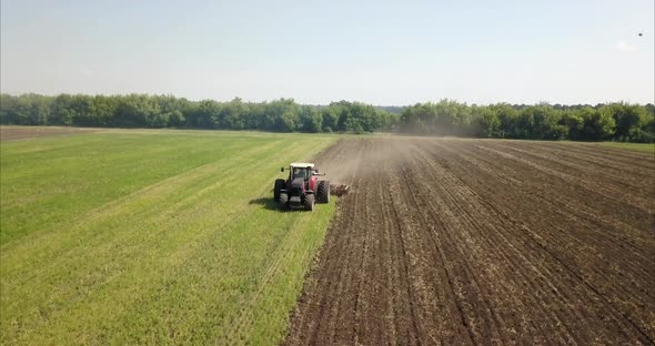 drone shoot how tractor is cultivating black earth in ukraine //drone 4k