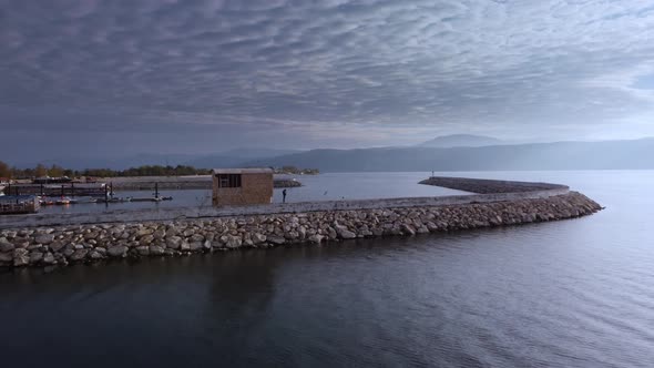 Drone Footage of Stone Mounds Surrounding Piers with Moored Ships in Egirdir Lake