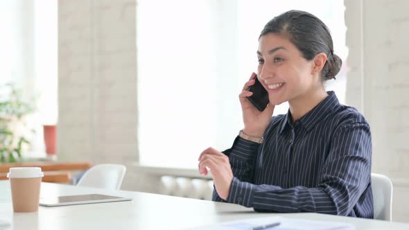 Young Indian Woman Talking on Smartphone 