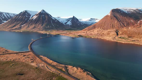 Drone Over Empty Road Over Fjords Towards Mountains