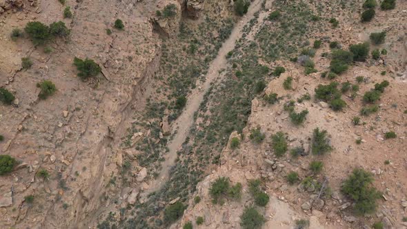 Aerial view looking down at dry wash in the Utah desert