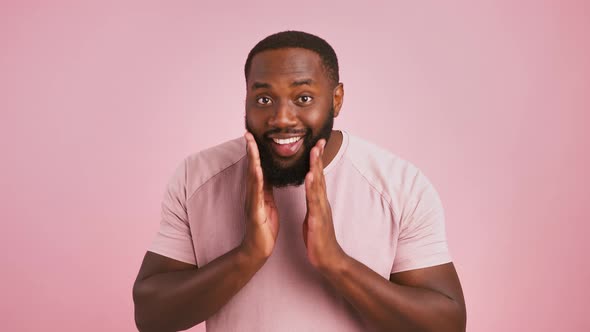 Playful African American Man Preening His Beard Winking to His Mirror Reflection at Camera Pink