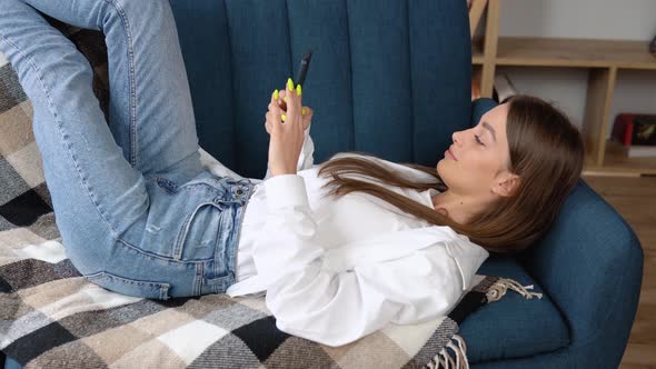 Attractive Woman Enjoy Shopping Online on Bed at Home in Morning