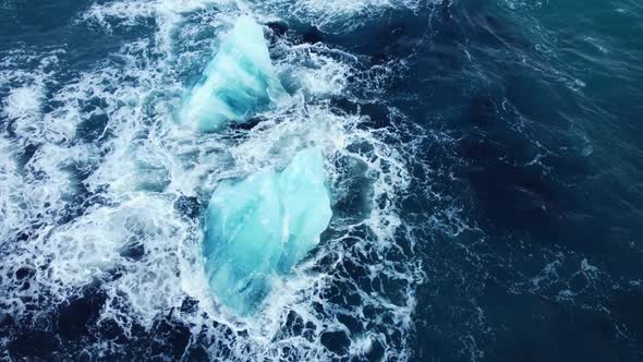 Iceberg in the Ocean Huge Chunks of Blue Ice Floating on the Waves Arctic Landscape Aerial View