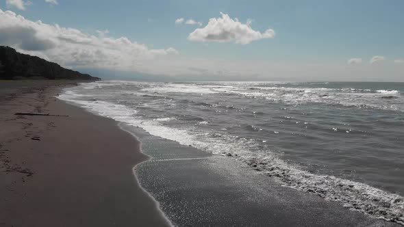 Drone flying over of big waves in Shekvetili sand beach