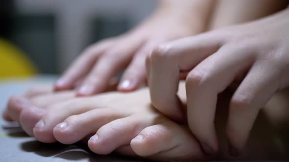 Child Hands Massage Skin the Toe and Little Fingers