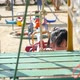 Cute Asian Child Climbing Rope At The Playground - VideoHive Item for Sale