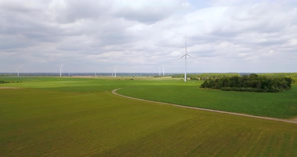 Aerial of a field of wind turbines on a farm