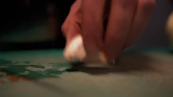 Cutting Large Mushroom on Thin Slices