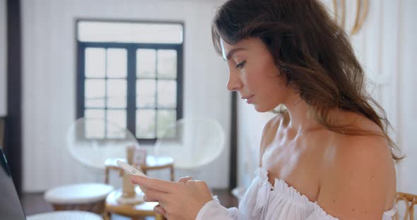 Bright Color Cafe Woman Typing the Massage Cheerful Female Sending a Message to Her Friend