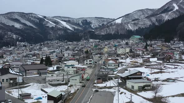 aerial of nozwa onsen town in the mountains of nagano japan during winter