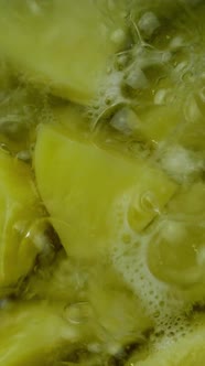 Coarsely Chopped Potatoes Boiling in Hot Water in Metal Saucepan for Cooking Mashed Potatoes