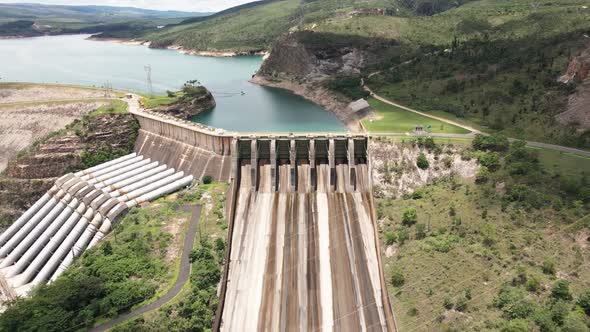 Cinematic drone footage - flying sideways over the river showing a hydroeletric at minas gerais in B