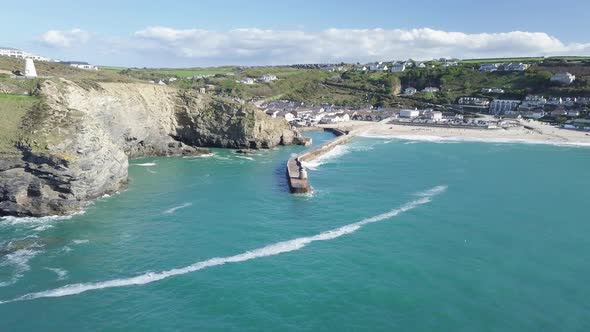 Turquoise Waters And Tranquil Landscape Of Portreath Cornwall In Summer - aerial wide shot