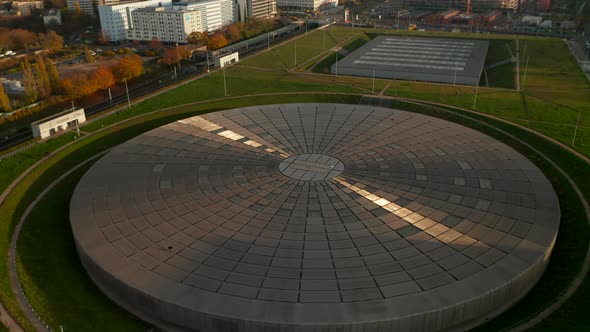 Modern Futuristic Flat Building Architecture, Velodrome Arena in Berlin, Germany with Sun Reflection