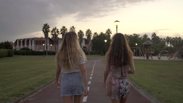 Slow motion shot of young women walking in park