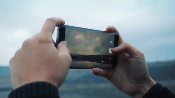 Woman Taking Picture with Smartphone