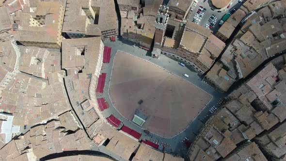 Flying over Piazza del Campo - main public space of the historic center of Siena