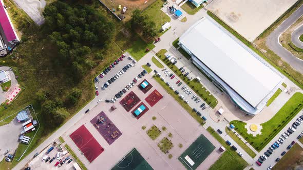 Flight Over the Parking Lot and Covered Spectator Stand