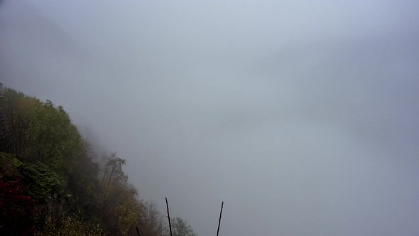 Clouds and Fog Over Geirangerfjord And Mountains From Ornesvingen Viewpoint In Norway. - timelapse