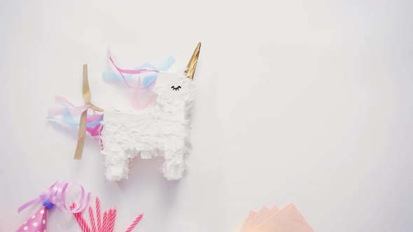 Small unicorn pinata on a white background.