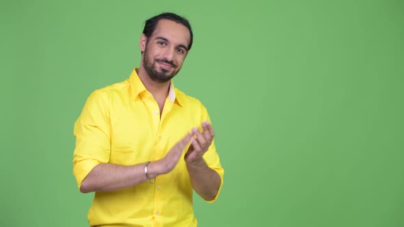 Young Happy Bearded Indian Businessman Clapping Hands