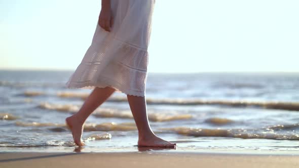 Pretty Woman Walks at Seaside Surf