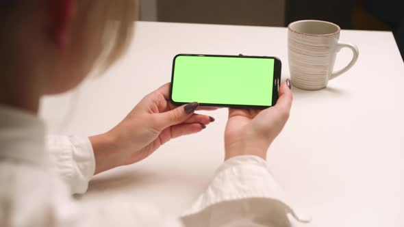 Close Up Woman Holds Phone Green Screen Chromakey Girl Watching Content Without Touching Gadget