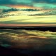 A slow flight low over the lake at sunset. UHD 30fps - VideoHive Item for Sale