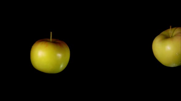 Two Juicy Apples Collide with Each Other and Spin 