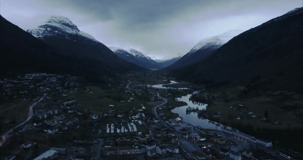 Aerial shot of Stryn surrounded by mountains at Twilight, Norway