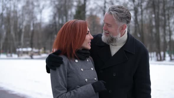 husband and wife walk in the park, seeing local attractions