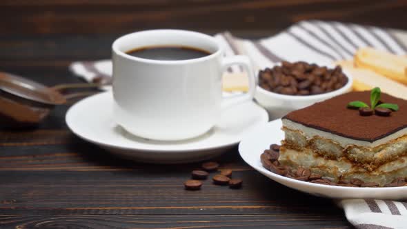 Portion of Traditional Italian Tiramisu Dessert Cup of Espresso and Coffee Beans