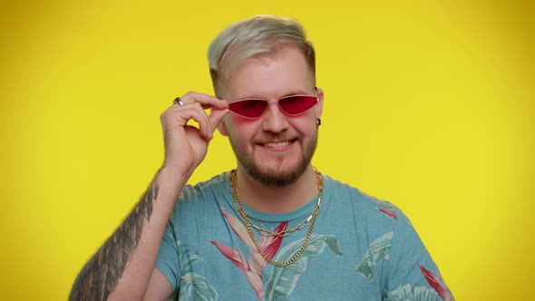 Playful Happy Man Wearing Sunglasses Blinking Eye Looking at Camera with Smile Winking Flirting