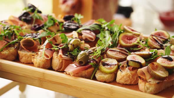 Bruschetta with Dried Meat Arugula and Figs with Sauce