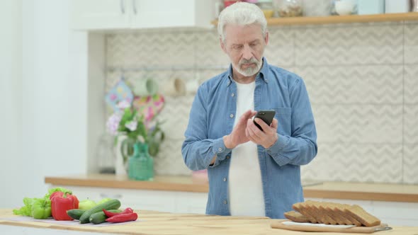 Old Man Using Smartphone