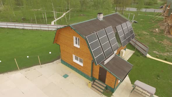 Aerial View of Eco-friendly House with Solar Panels Karelian Landscape on Back