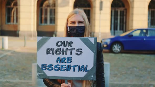 Protest Walk Woman in Mask Urging to Pay Attention on Human Rights Protection